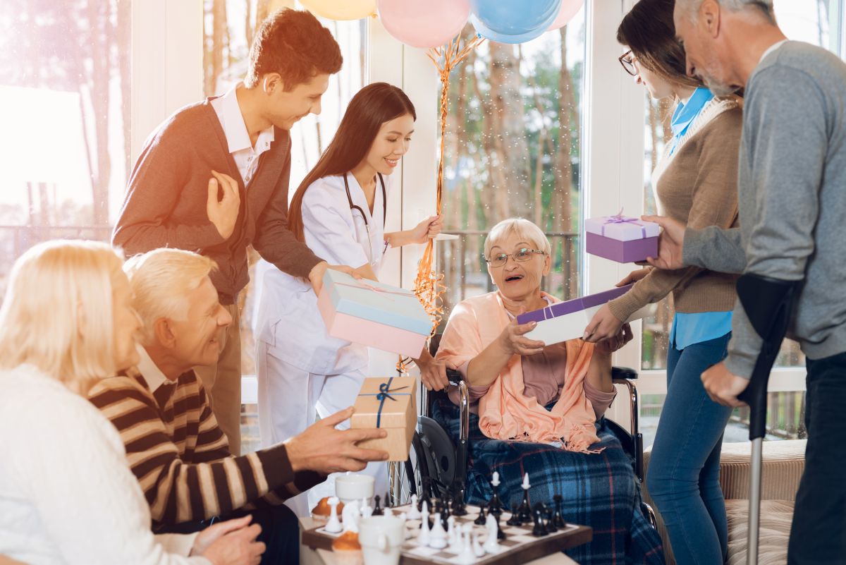 Family members gather around grandma during a party